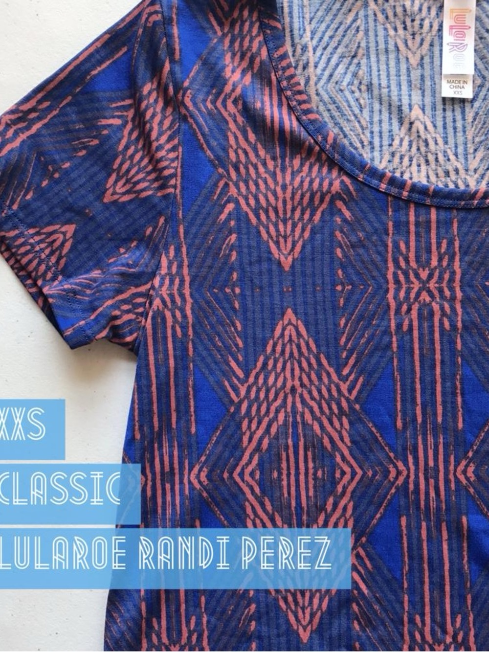 LuLaRoe Short Sleeve Scoop Neck Top in Blue and Pink Geometric Print